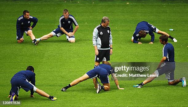 Roy Hodgson, manager of West bromwich Albion talks to Gabriel Tamas during a West Bromwich Albion Training session at the Hawthorns on August 12,...