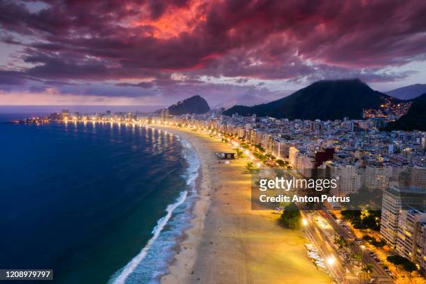 panorama of rio de janeiro at twilight, brazil. copacabana beach at sunset. rio de janeiro - ipanema beach stock pictures, royalty-free photos & images
