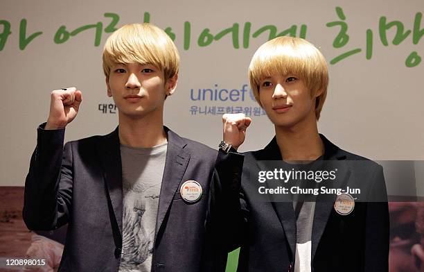 Key and Taemin of SHINee arrive at the Inauguration Ceremony for "Together For Africa" by South Korea's Red Cross and UNICEF at the Plaza Hotel on...
