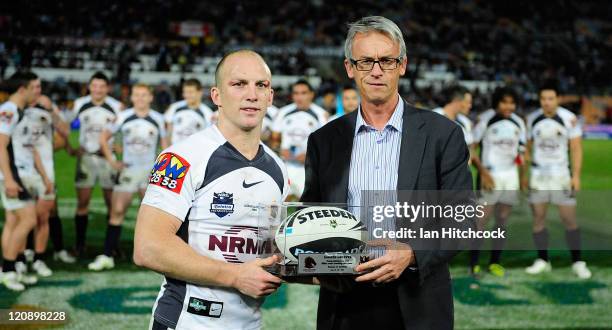 Darren Lockyer of the Broncos poses with NRL CEO David Gallop after playing his 350th match at the end of the round 23 NRL match between the North...