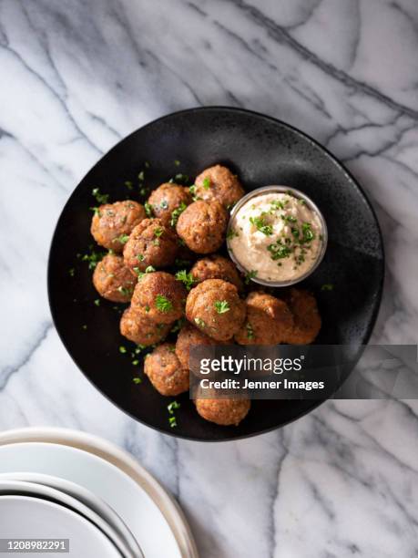 vegan meatballs on a plate with hummus dip. - meatballs foto e immagini stock