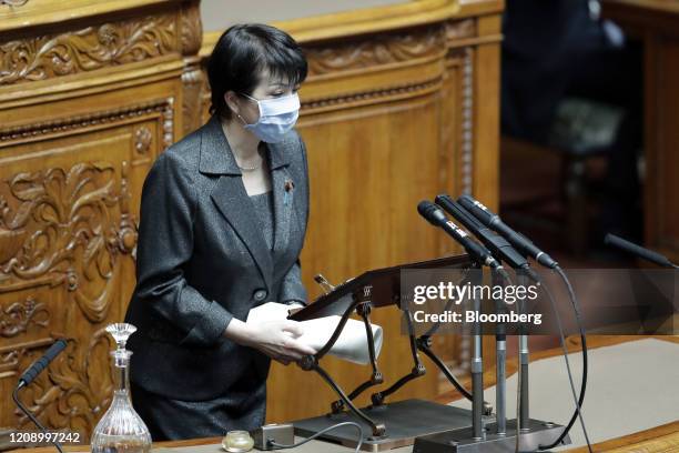 Sanae Takaichi, Japan's internal affairs minister, wearing a protective mask, speaks during a plenary session at the upper house of parliament in...