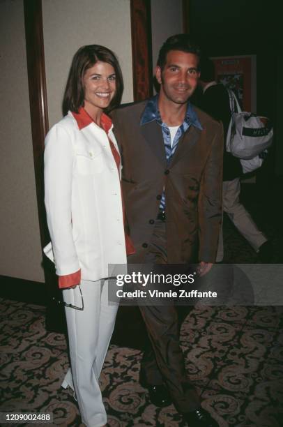 American actress, model, and producer Lori Loughlin and American fashion designer Mossimo Giannulli attend the 4th Annual Race to Erase MS Gala at...