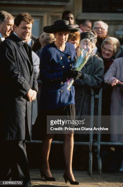 Diana, Princess of Wales during a visit to Peterborough, UK, January 1991. She is wearing a blue suit by Chanel and a black hat.