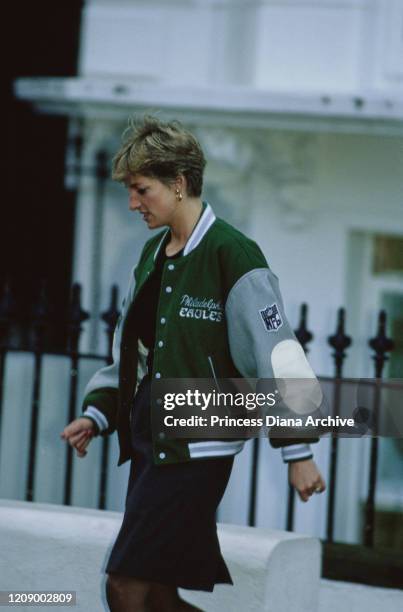 Diana, Princess of Wales wearing a Philadelphia Eagles jacket to drop off her son Prince Harry at Wetherby School in London, January 1991.