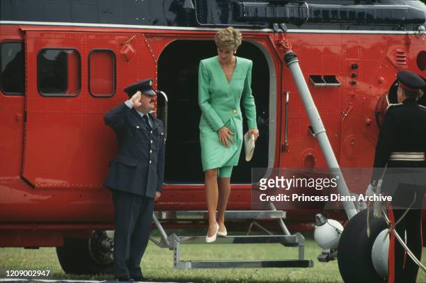 Diana, Princess of Wales arrives in Dorchester, UK, July 1991. She is wearing a green coat-dress by Catherine Walker.