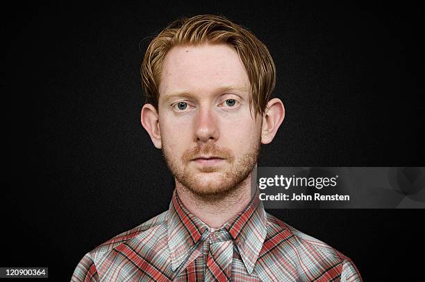 studio portrait on black - red head man fotografías e imágenes de stock