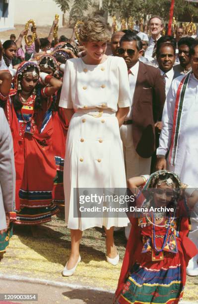 Diana, Princess of Wales during a visit to the Lalapet High School in Hyderabad, India, 14th February 1992. On the bottom right is young dancer...