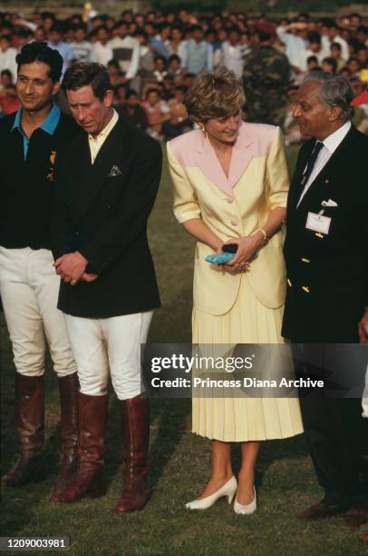 Prince Charles and Diana, Princess of Wales attend a polo match at the Rajasthan Polo Club in Jaipur, India, 13th February 1992. Diana is wearing a...