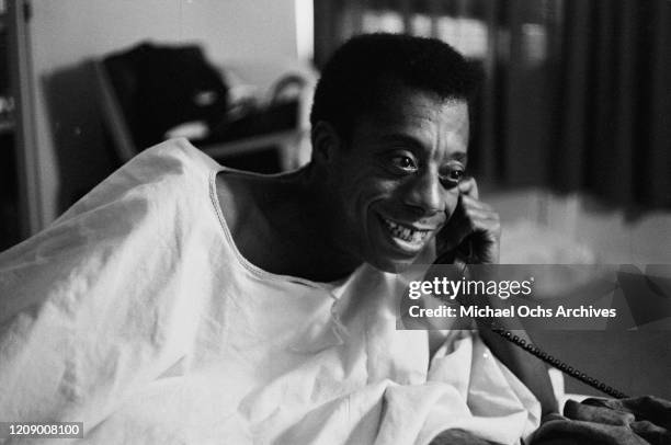 American novelist and activist James Baldwin on the telephone, USA, October 1963.