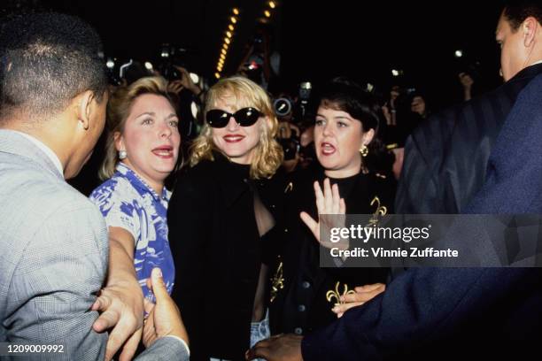 American singer Madonna and actress Rosie O'Donnell attend the New York premiere of the film 'A League of Their Own', USA, 25th June 1992. They both...