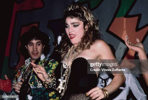 American singer Madonna celebrates the end of her Virgin Tour at the Palladium nightclub in New York City, 1985.