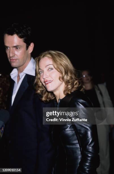 American singer Madonna with English actor Rupert Everett at the premiere of the film 'An Ideal Husband' in Hollywood, California, 10th June 1999.