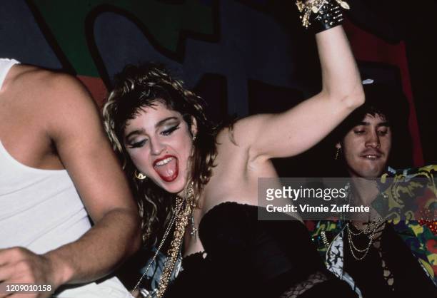American singer Madonna celebrates the end of her Virgin Tour at the Palladium nightclub in New York City, 1985.