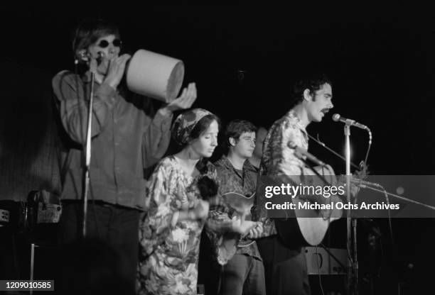 The Jim Kweskin Jug Band in concert, circa 1966. From left to right, they are Fritz Richmond on the jug, Maria D'Amato Muldaur, Geoff Muldaur and Jim...