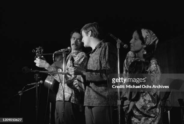 The Jim Kweskin Jug Band in concert, circa 1966. From left to right, they are Jim Kweskin and Geoff Muldaur on the guitar, and fiddle player Maria...