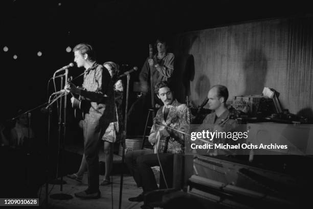 The Jim Kweskin Jug Band in concert, circa 1966. On the left is Geoff Muldaur on the guitar with Maria D'Amato Muldaur behind him, with Jim Kweskin...