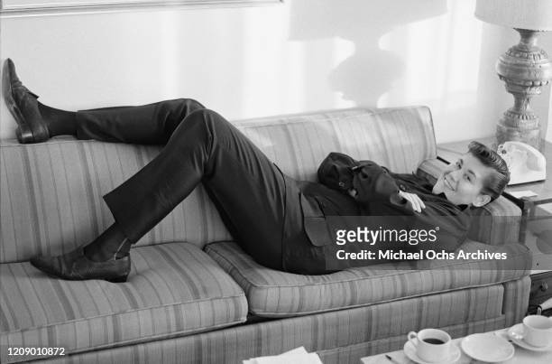 American singer and actor Wayne Newton relaxing in a hotel room, circa 1966.