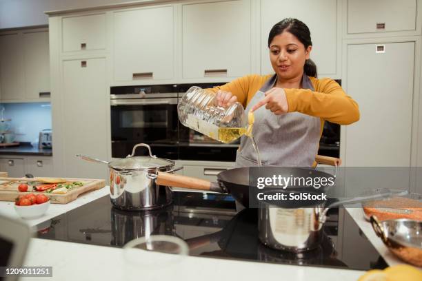 Adding Fresh Oil Adding Oil Photos and Premium High Res Pictures - Getty Images