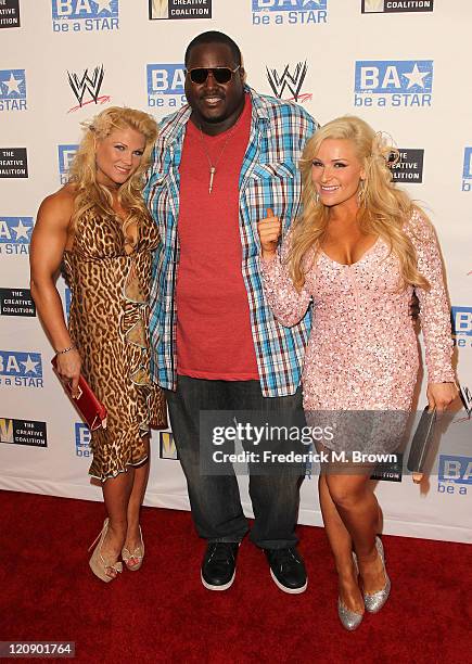 Beth Phoenix, actor Quinton Aaron and Natalya attend the WWE and The Creative Coalition's "be a Star" SummerSlam Kickoff Party at The Andaz Hotel on...