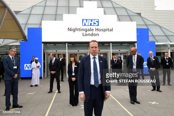 Britain's Health Secretary Matt Hancock prepares for the opening of the "NHS Nightingale" field hospital, created at the ExCeL London exhibition...