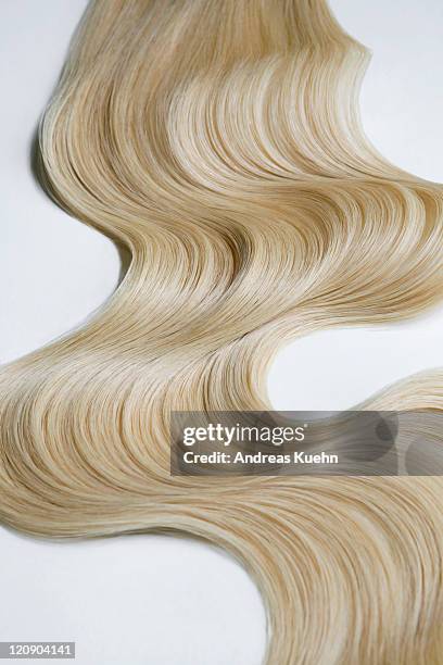 blond wavy hair on white background. - smooth hair stock pictures, royalty-free photos & images