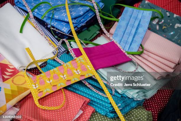 Self-sewn protective face masks in a fabric store on April 3, 2020 in Jena, Germany. A three-part city ordinance is going into effect requiring...