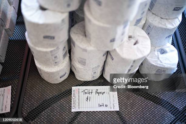 Toilet paper sits for sale, where proceeds go to staff members, at Chef Geoff's restaurant in Washington, D.C., U.S., on Thursday, March 26, 2020. As...