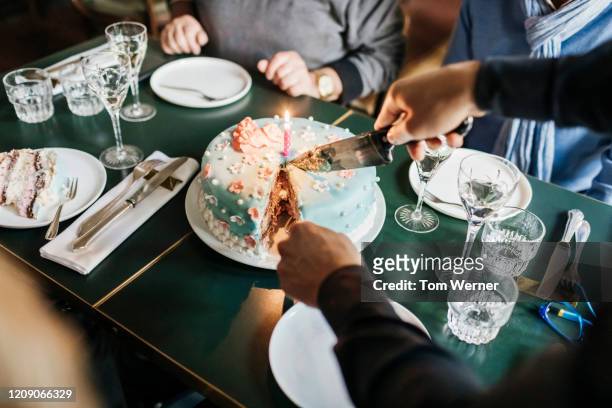 birthday cake being served in restaurant - ケーキ　カット ストックフォトと画像