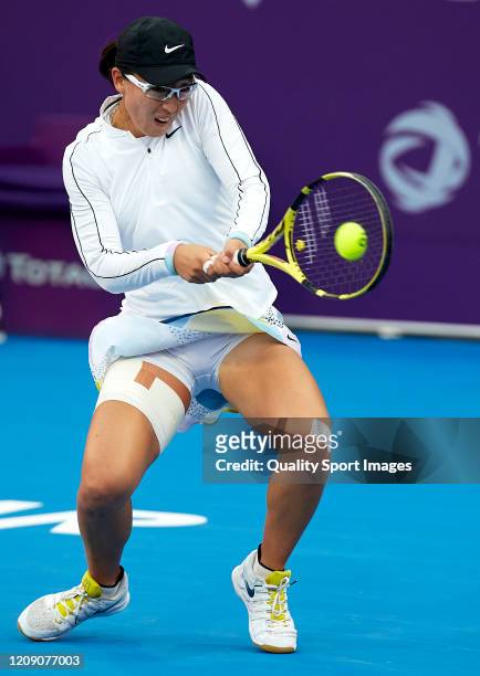 Saisai Zheng of China returns the ball against Aryna Sabalenka of Belarus during day five of the WTA Qatar Total Open 2020 at Khalifa International...