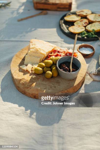 cheese and olives on wooden board - palma majorca stock pictures, royalty-free photos & images