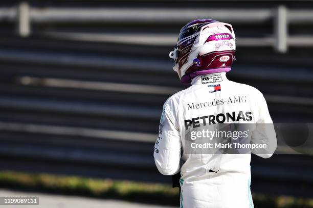Lewis Hamilton of Great Britain and Mercedes GP walks on a circuit road after his car stopped on track during Day Two of F1 Winter Testing at Circuit...