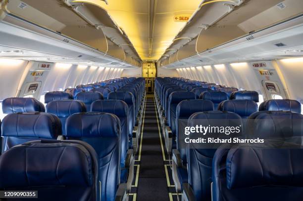 single aisle aircraft interior - aisle seat airline stock-fotos und bilder