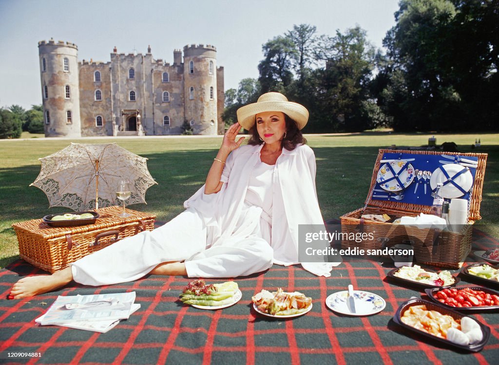Actress Joan Collins Having A Picnic In The English Countryside In June 2007.