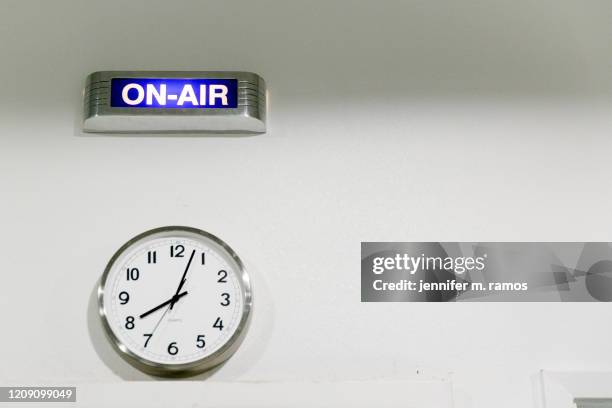 on air sign and clock at a radio station in far west texas - on air sign stock-fotos und bilder