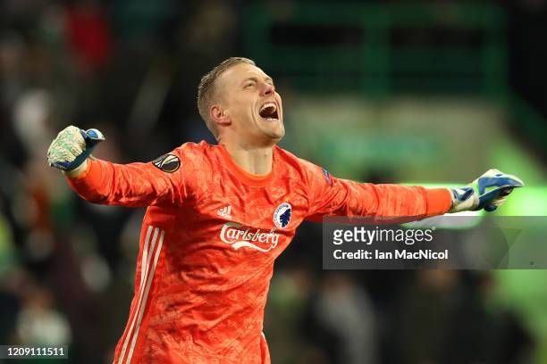 Karl-Johan Johnsson of FC Copenhagen celebrates his sides third goal during the UEFA Europa League round of 32 second leg match between Celtic FC and...