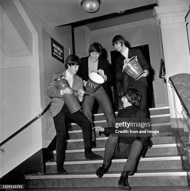 English singer, songwriter and guitarist George Harrison , English singer, songwriter and bassist Paul McCartney, English singer and drummer Ringo...