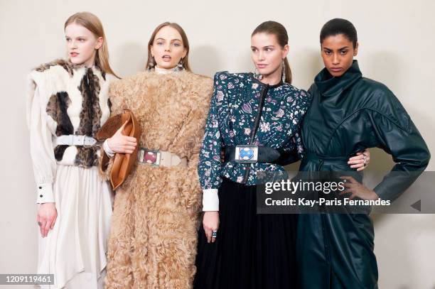 Models Hannah Motler, Luna Bijl and Imaan Hammam pose backstage in firstlooks before the Isabel Marant Womenswear Fall/Winter 2020/2021 show as part...