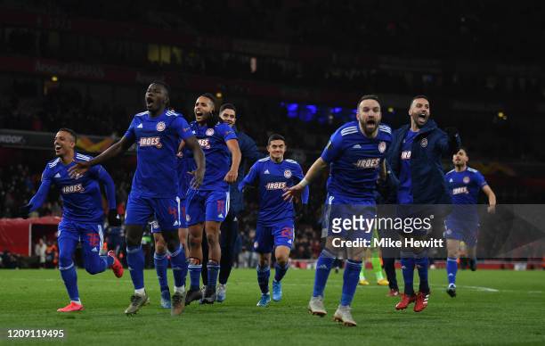 Youssef El Arabi of Olympiacos FC celebrates victory with his teammates after the UEFA Europa League round of 32 second leg match between Arsenal FC...