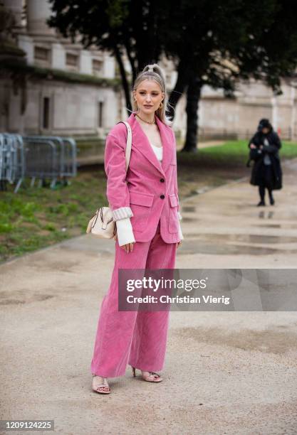 Victoria Magrath is seen wearing pink corduroy blazer and pants, bag outside Chloe during Paris Fashion Week - Womenswear Fall/Winter 2020/2021 : Day...