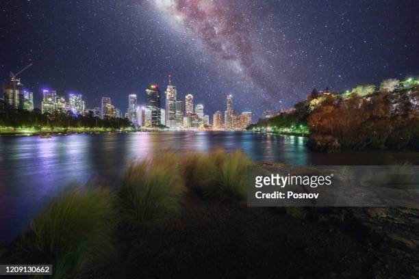 milky way over brisbane, queensland - brisbane cityscape stock pictures, royalty-free photos & images