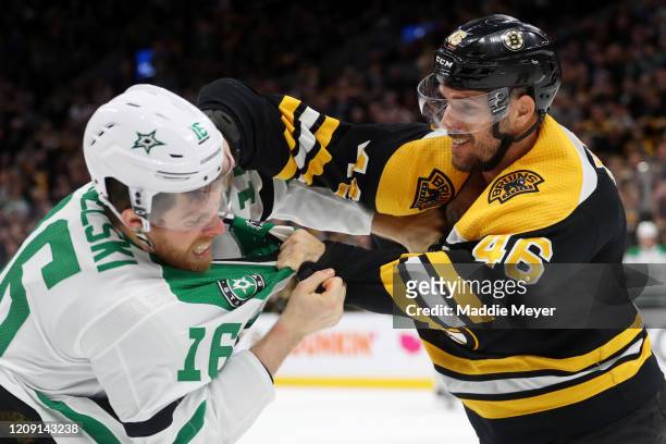David Krejci of the Boston Bruins and Joe Pavelski of the Dallas Stars fight during the second period at TD Garden on February 27, 2020 in Boston,...