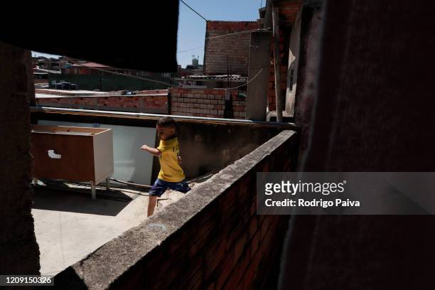 Boy plays in Jardim do Vale das Virtudes Favela at Campo Limpo neighborhood on April 4, 2020 in Sao Paulo, Brazil. According to the Ministry of...
