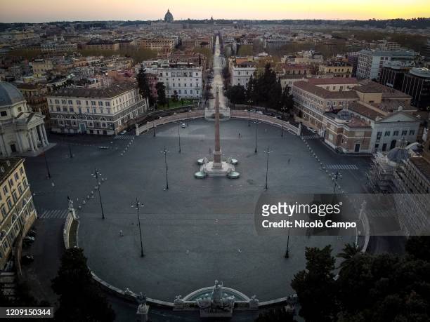 General view shows almost deserted Piazza del Popolo. The Italian government imposed unprecedented restrictions to halt the spread of COVID-19...