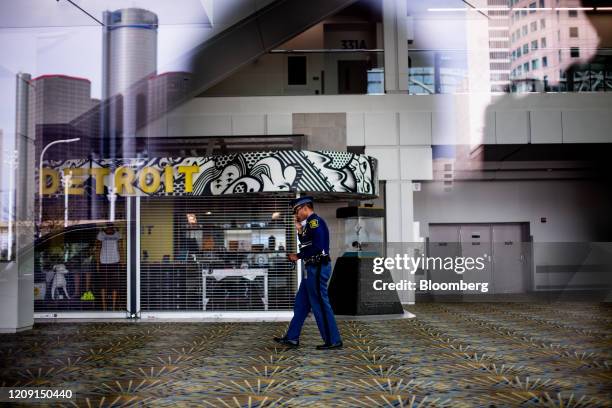 Member of the Michigan State Police walks through the TFC Center in Detroit, Michigan, U.S., on Saturday, April 4, 2020. The coronavirus pandemic is...