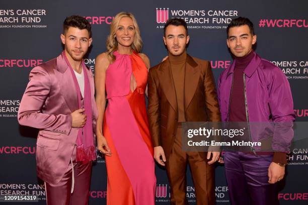 Jamie Tisch Nick Jonas, Kevin Jonas, and Joe Jonas of The Jonas Brothers attends WCRF's "An Unforgettable Evening" at Beverly Wilshire, A Four...