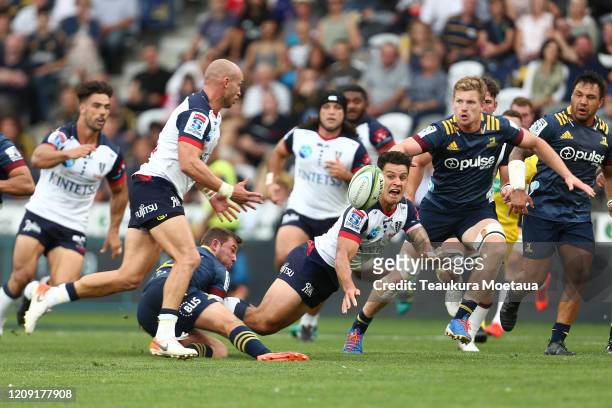 Matt Toomua of the Rebels passes during the round five Super Rugby match between the Highlanders and the Rebels at Forsyth Barr Stadium on February...