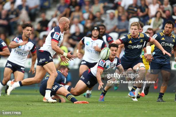 Matt Toomua of the Rebels passes during the round five Super Rugby match between the Highlanders and the Rebels at Forsyth Barr Stadium on February...