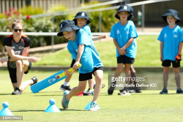 The New Zealand Womens cricket team and school children participate during the ICC Women's T20 Cricket World Cup Cricket 4 Good Clinic at Albert...
