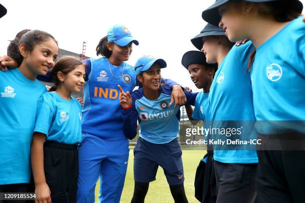 Jemimah Rodrigues and Radha Yadav of the India Womens cricket team and school children participate during the ICC Women's T20 Cricket World Cup...